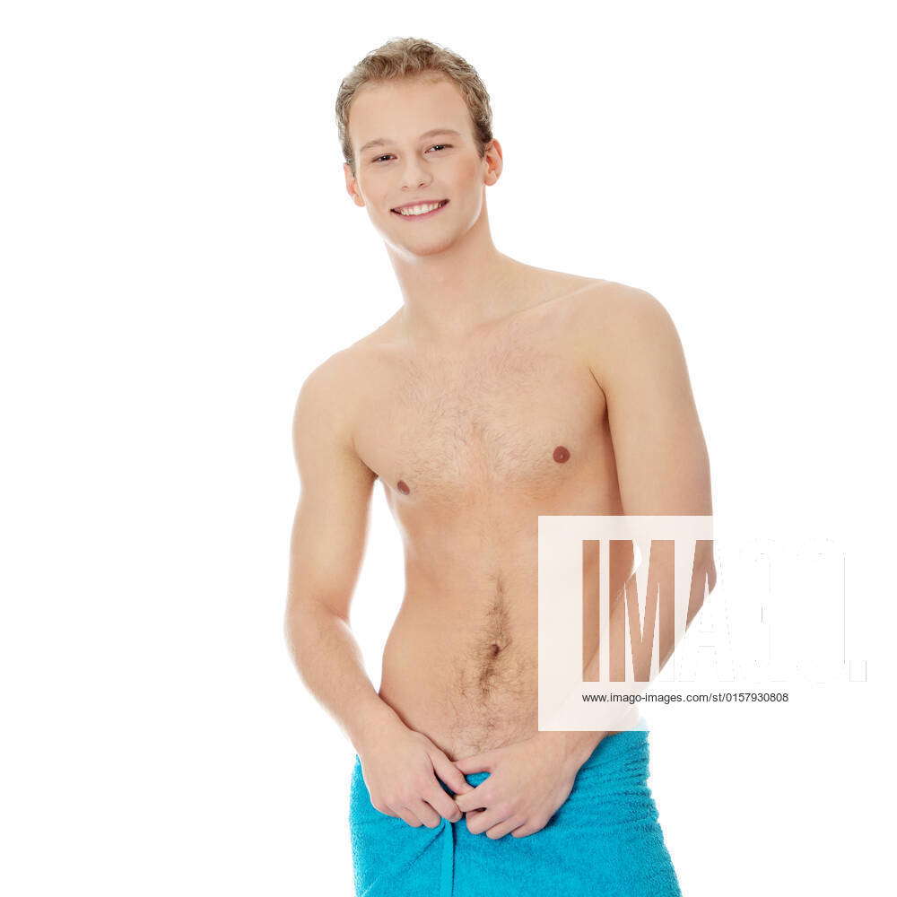 Handsome, young, naked man with the towel around his waist. Isolated on  white, model released