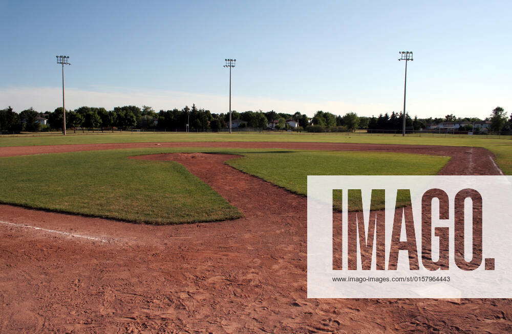 A view of a baseball diamond at dusk. , 2280763, ball, base, baseball