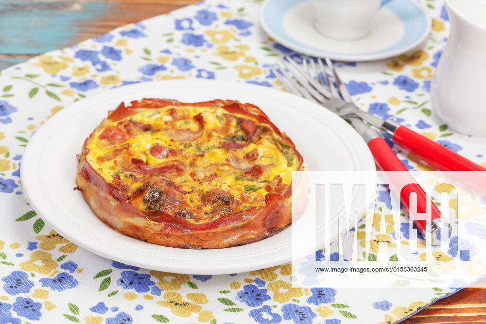 Smoked bacon, leek and roast garlic quiche. Macro, selective focus