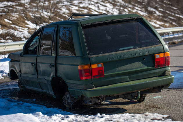 View of crashed Range Rover car in the highway. Broken car. Automobile ...