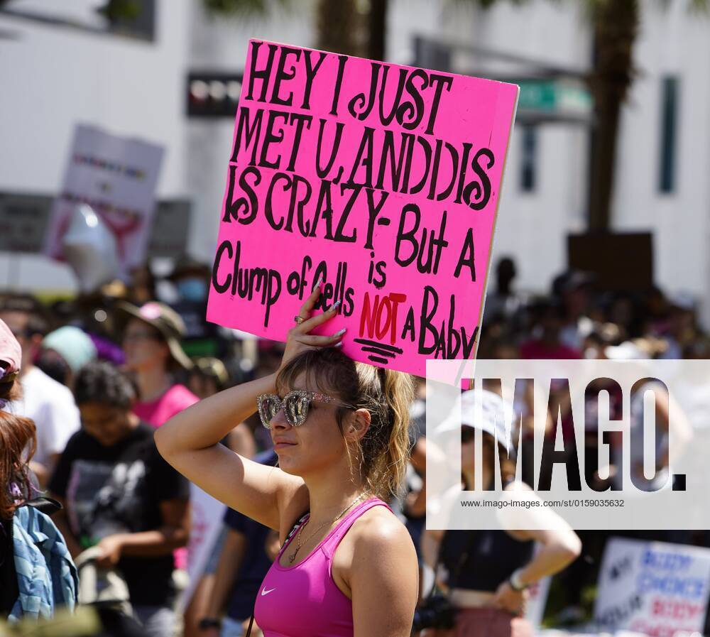 May 14, 2022, Tampa, Florida, USA: Adult film star Carmen Caliente holds up  a sign alongside