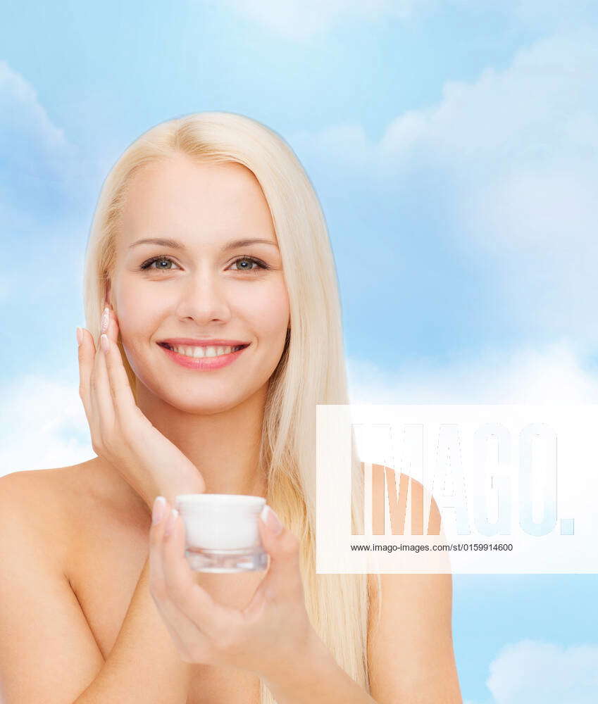 Cosmetics Health And Beauty Concept Beautiful Woman Applying Cream