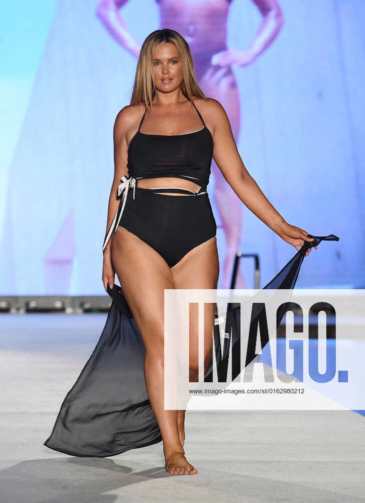 MIAMI BEACH FL JULY 16 Georgina Burke walks the runway for