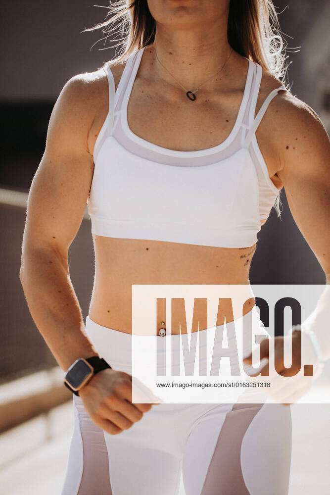 Faceless fitness model posing outside in white sports bra and wh St. George,  Utah, United States
