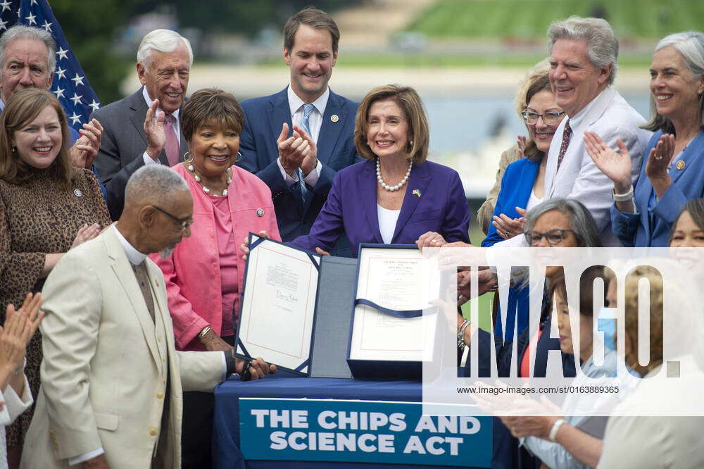 Speaker of the House Nancy Pelosi, DCA, displays the signed The Chips