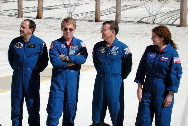 KENNEDY SPACE CENTER, FLA. -- Four members of the STS-81 crew pose in ...