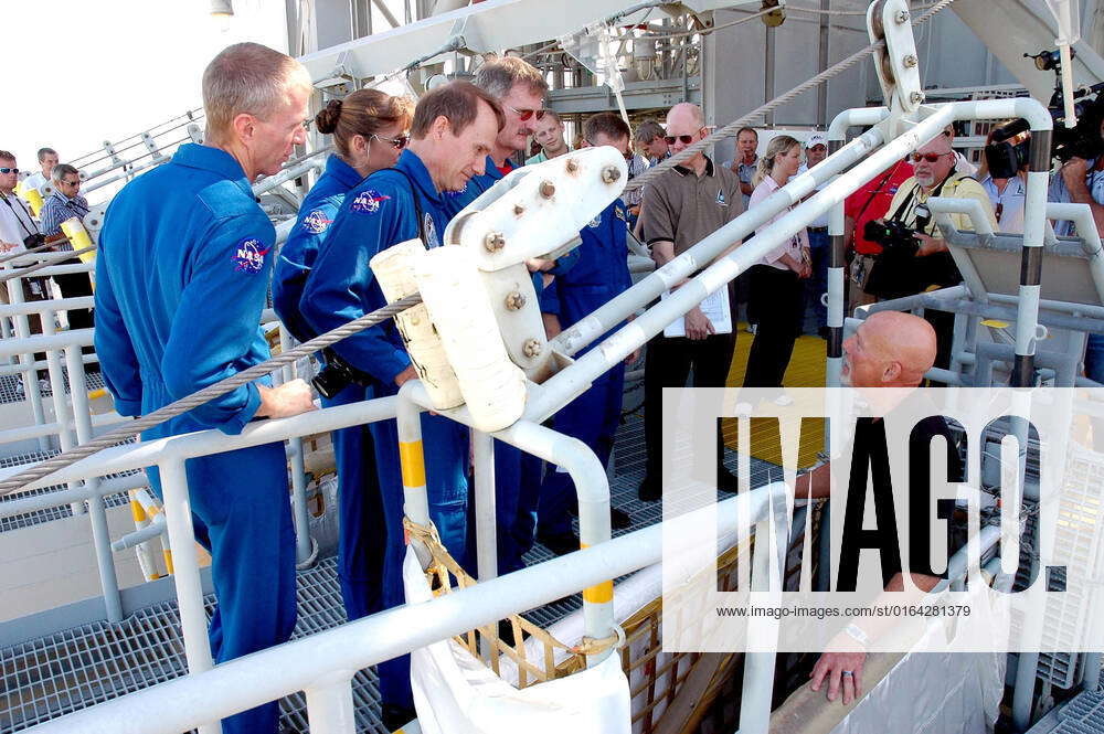 KENNEDY SPACE CENTER, FLA. - The STS-115 crew gets instructions about ...