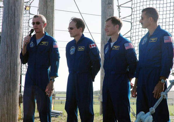 KENNEDY SPACE CENTER, Fla. -- The STS-104 crew responds to questions ...