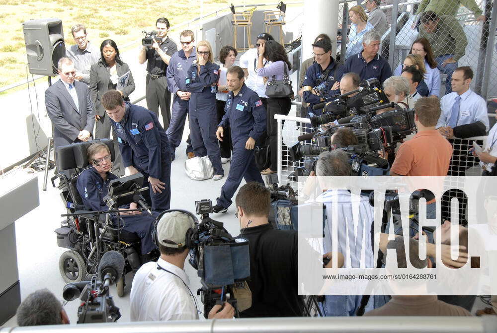 KENNEDY SPACE CENTER, FLA. The media surround noted wheelchairbound