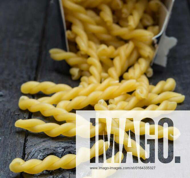 Gemelli noodle on dark rustic wood, Gemelli noodle on dark rustic wood