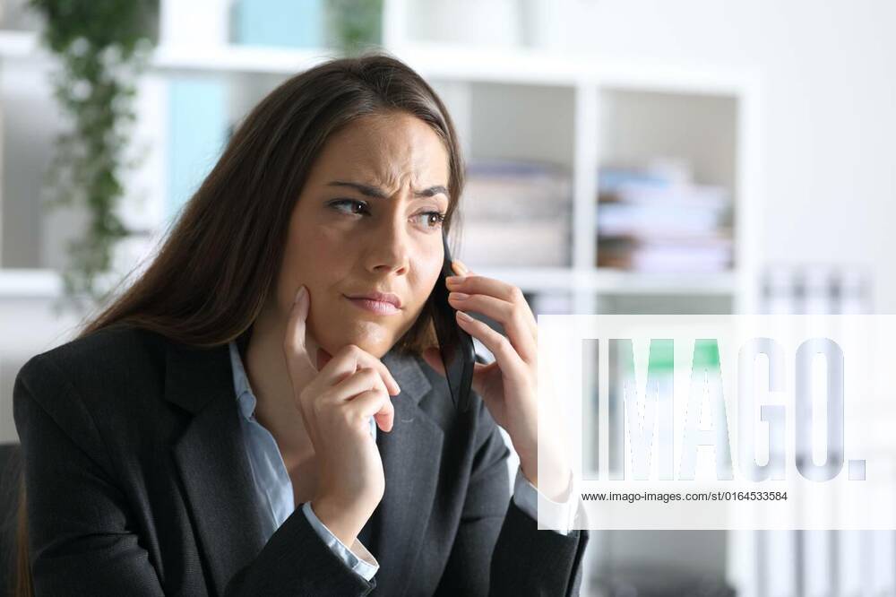 Suspicious Executive Calling On Smart Phone At Office Suspicious 