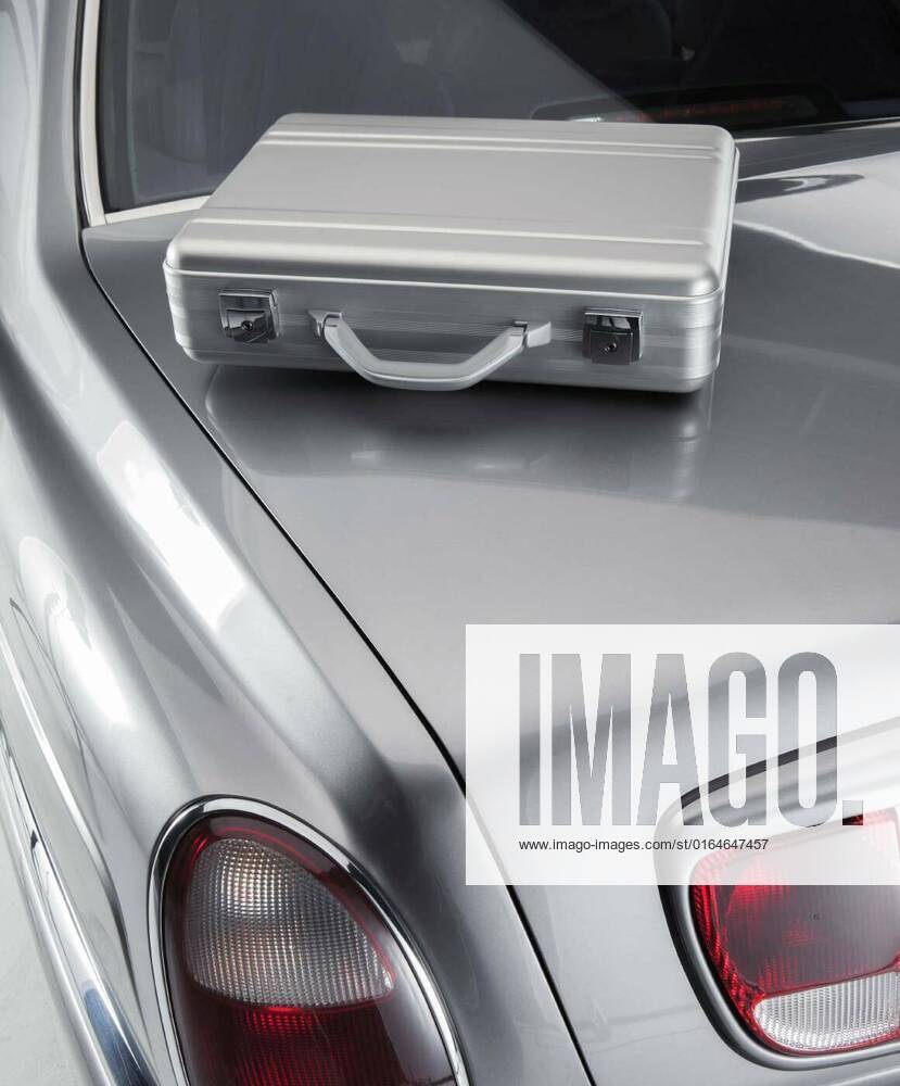 Briefcase on a luxury car, briefcase on a luxury car, briefcase on a