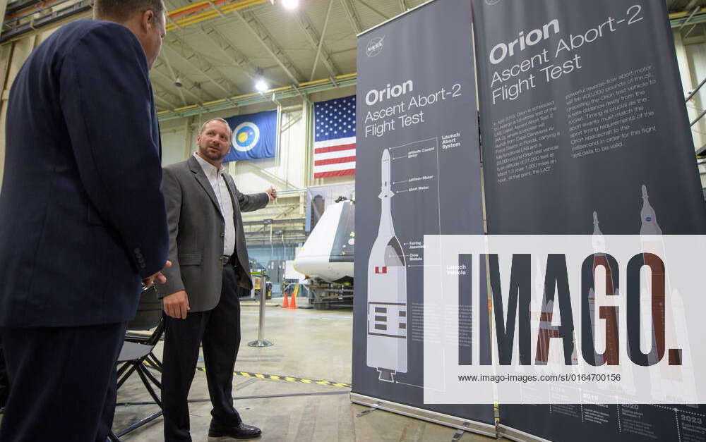 NASA Orion AA-2 Crew Module Manager Dr. Jon Olansen, right, talks to ...