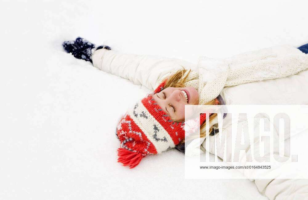 Winter Scene Blond Girl Laying Down On The Snow Copy Space On The 