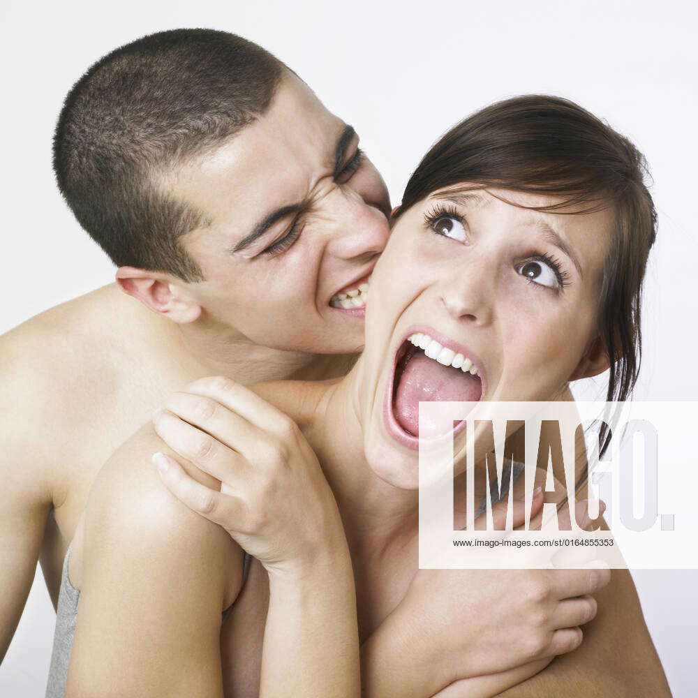 Young couple goofing around in the nude