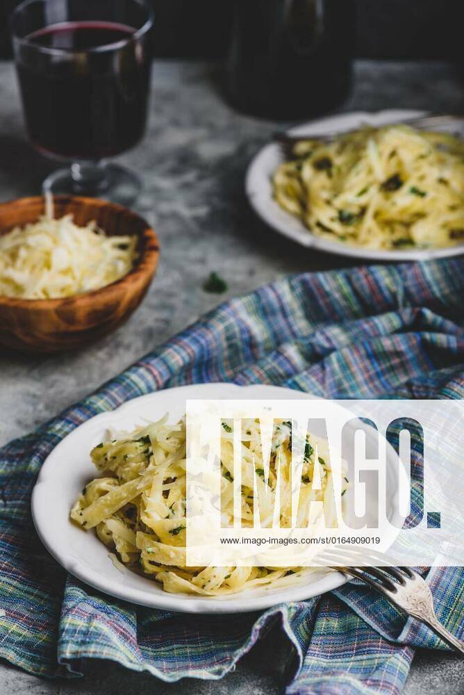 Portions of Pasta Alfredo, Portions of Homemade Pasta Alfredo on White