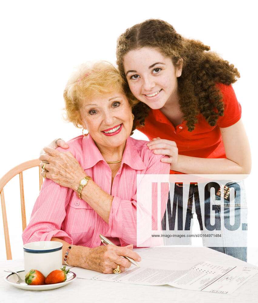 Teen Girl Helping Her Grandmother Fill Out An Absentee Ballot Isolated