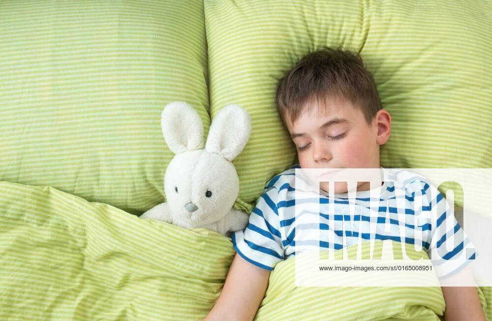 One year old baby in the bed, One year old baby lying in the bed with