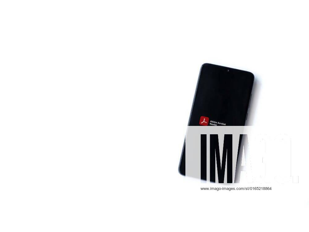 Adobe Acrobat Reader app launch screen with logo on the display of a