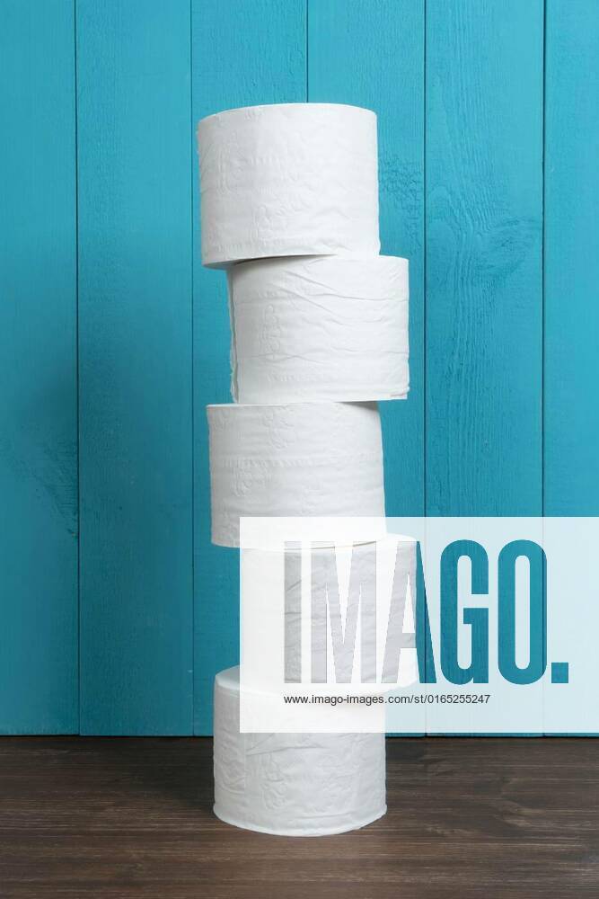 Rolls of toilet paper, some rolls of toilet paper on a wooden table