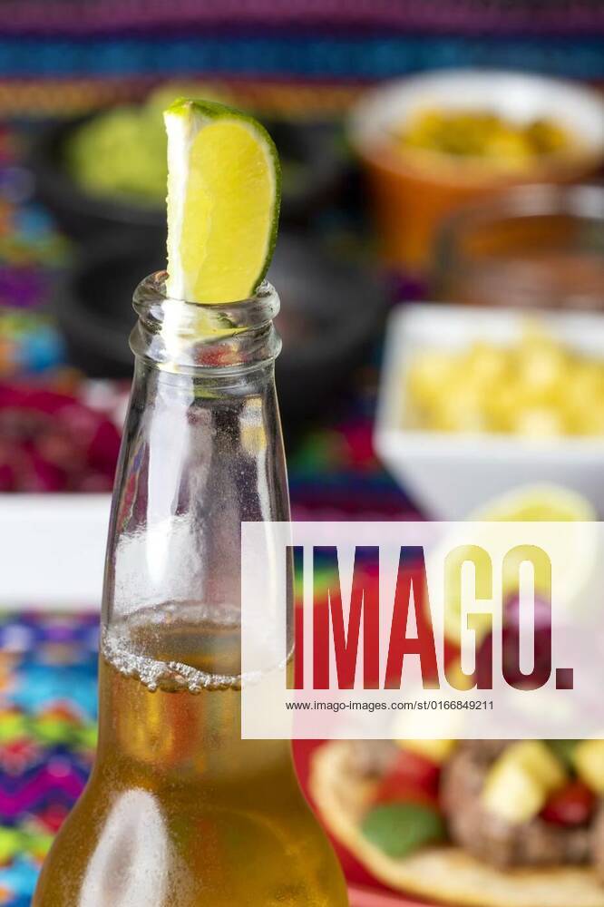 Lime in a beer, lime in a beer with mexican tortilla and salsas, lime