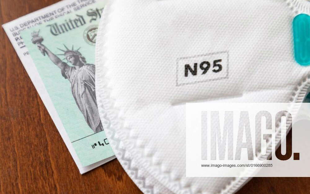 N95 Medical Face Mask Resting On IRS Covid-19 Economic Relief Check ...