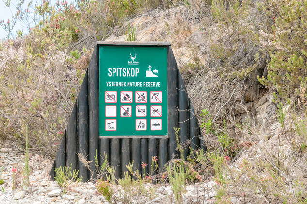 KNYSNA, SOUTH AFRICA - MARCH 5, 2016: An information board at the beach ...