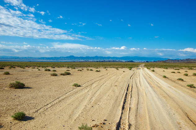 Dry road through steppe in far mountains in bright day , 3063289, 4x4 ...