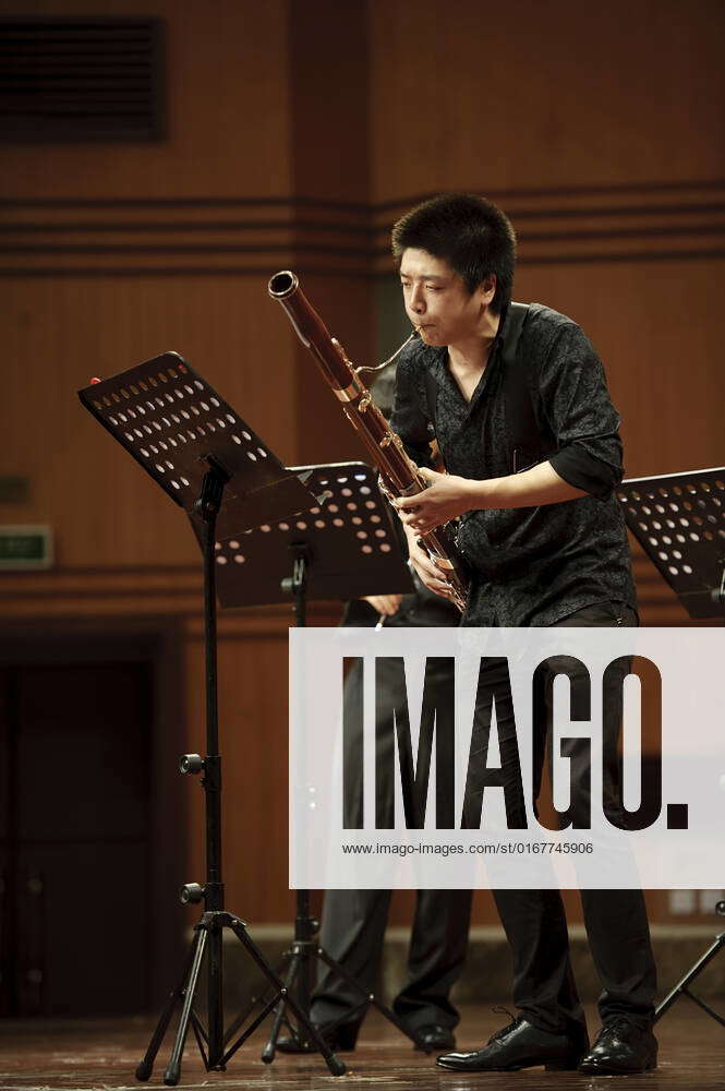 CHENGDU - JUN 20: bassoonist perform on wind music chamber music ...