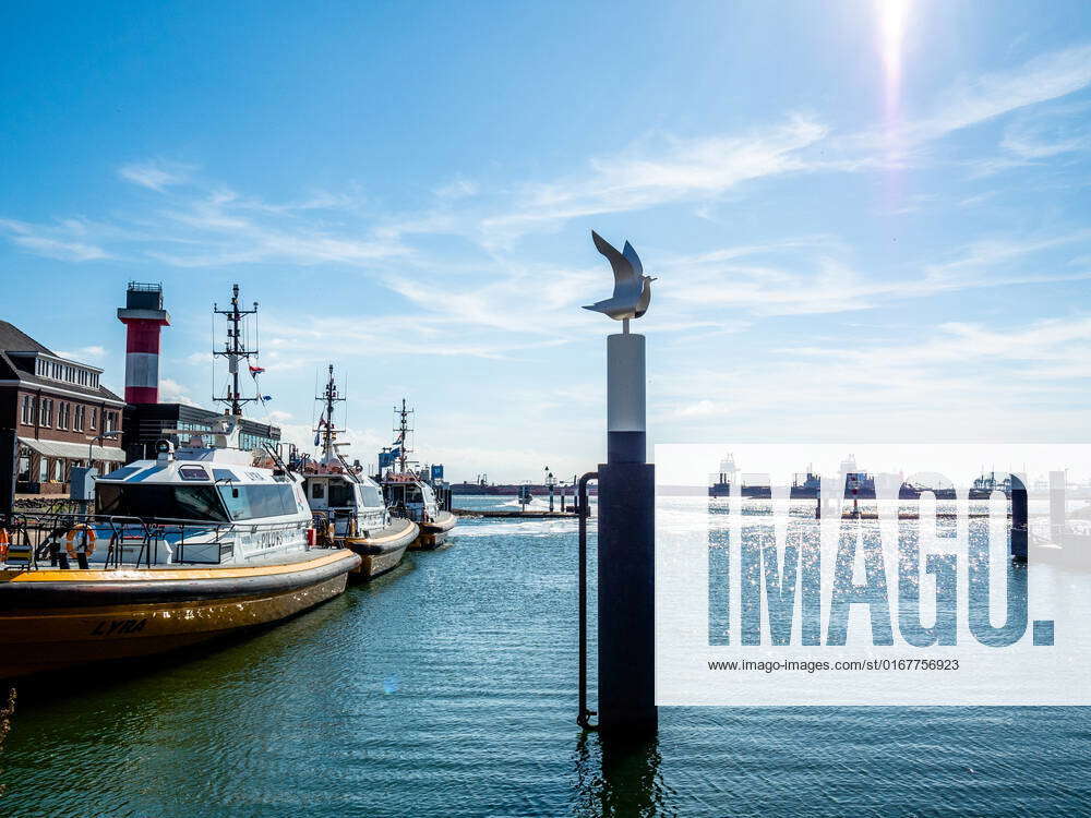 People Enjoying The Good Weather At The Hook Of Holland. A view from