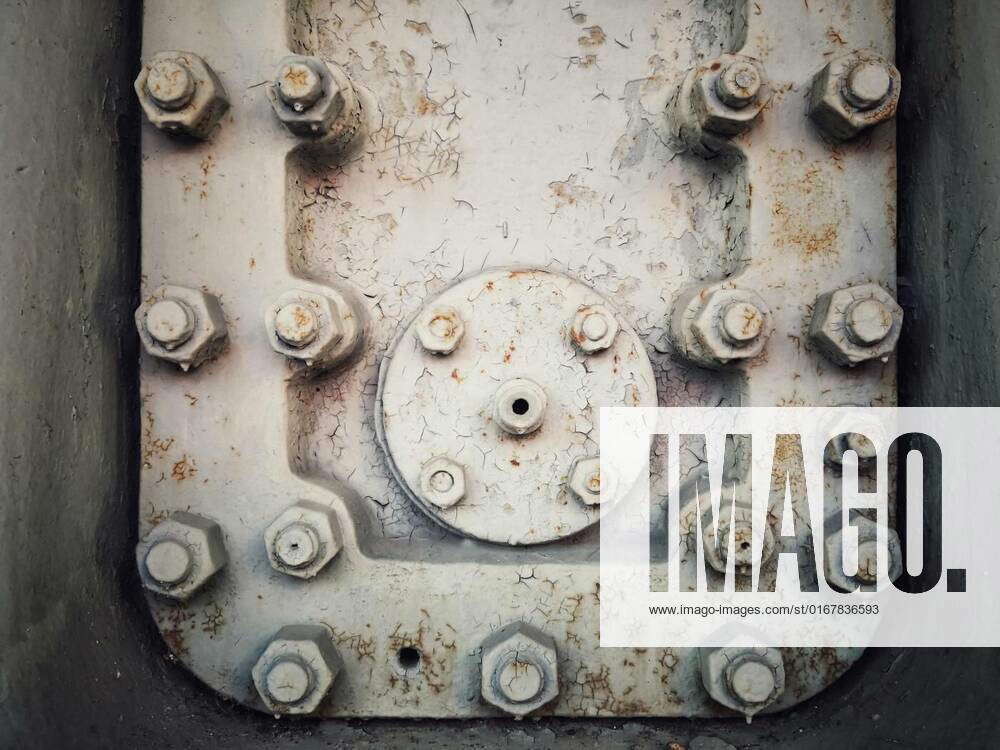 Rusty steel hatch door secured with nuts and bolts, A grungy rusty ...