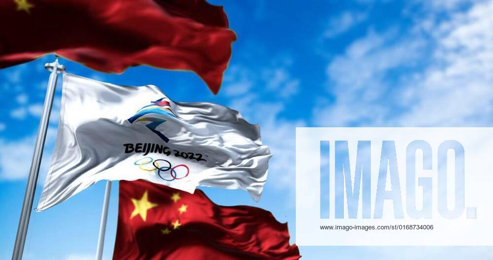 The flag of Beijing 2022 waving in the wind with the national flags of ...