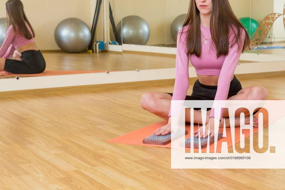 Practice of standing on nails. Closeup of a yoga man standing on a