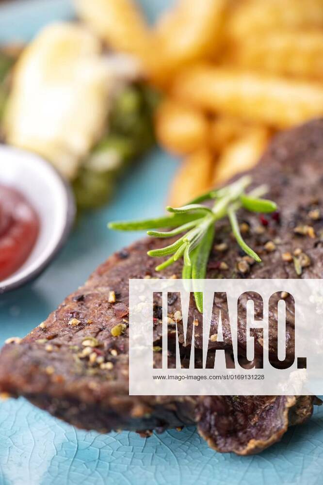 Rosemary on a steak, rosemary on a steak with fries, rosemary on a