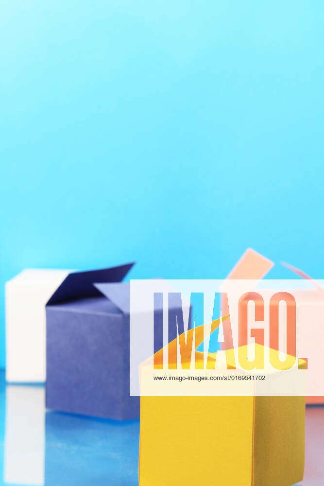 Four colored paper boxes on blue background with copy space, 1534621 ...