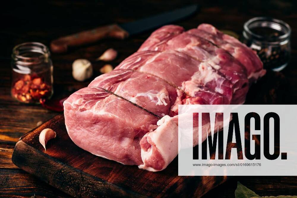 Pork loin joint with spices, Pork loin joint on chopping board with