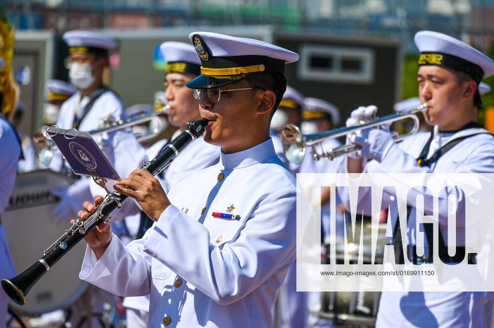 A South Korean navy band the arrival of the USS Ronald Reagan