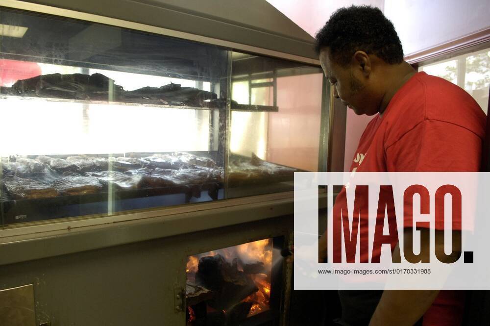 September 26, 2022 Owner Robert Adams Sr. cools down the wood fired