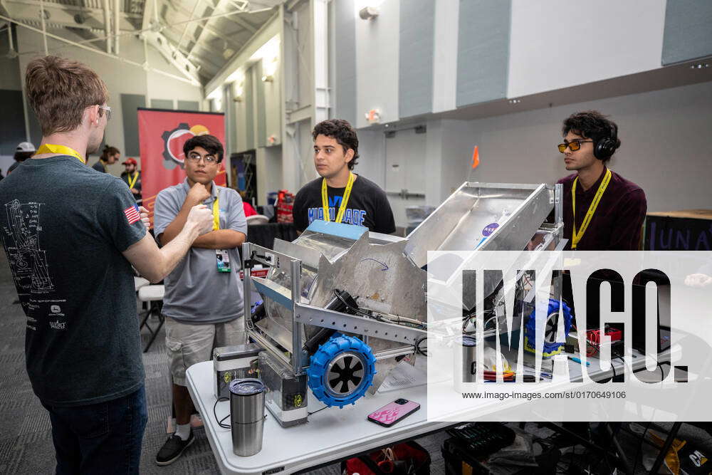 Students from Miami-Dade College at Kendall prepare their robotic miner ...