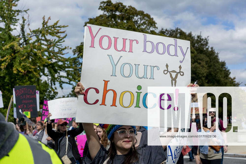 Womens Wave March 2022 Demonstrators Hold Signs During The Womens March