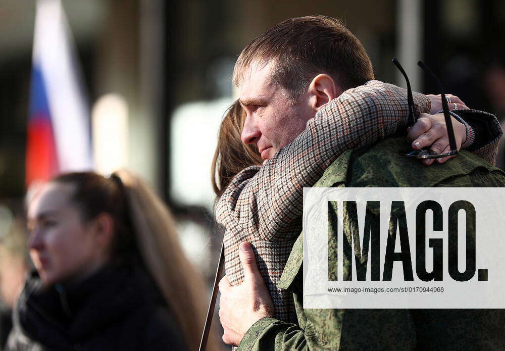 Russia. Moscow. A mobilised man says goodbye to his family at a ...