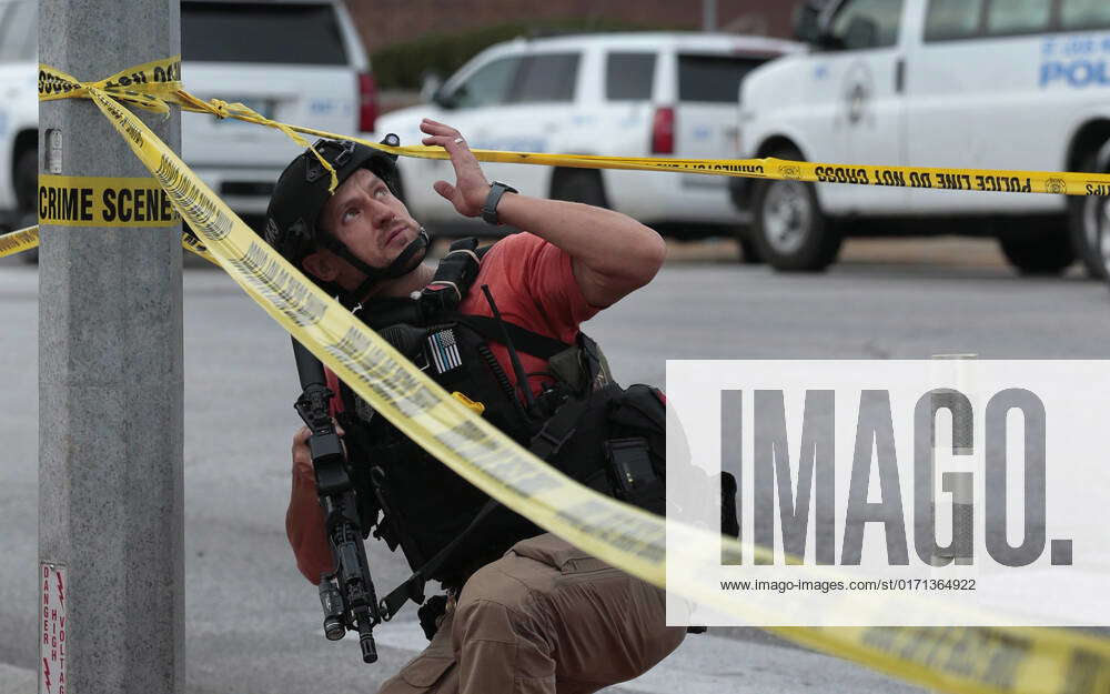 October 27, 2022, MO, USA: An ATF agent passes a St. Louis police SWAT ...