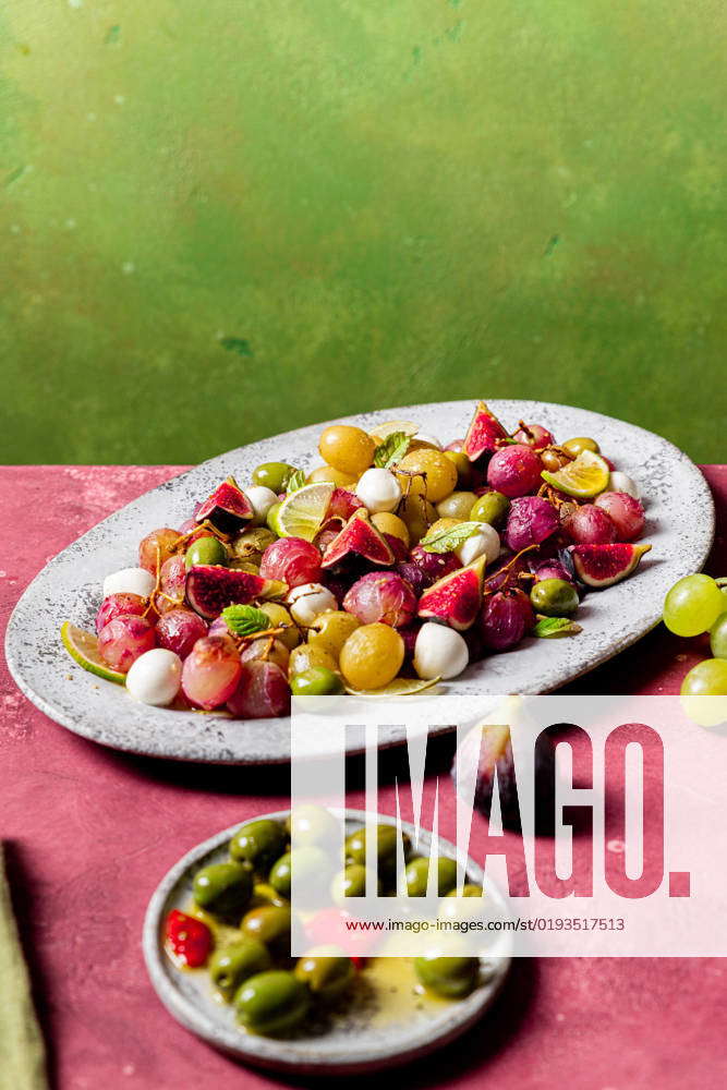 Fresh ripe grapes, olives, figs and mozzarella seasonal christmas salad
