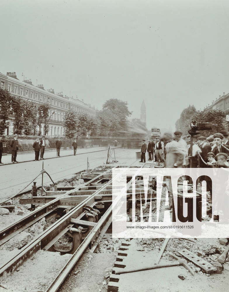 Workmen extending tramlines, Brixton Road, London, 1907. Artist: Unknown