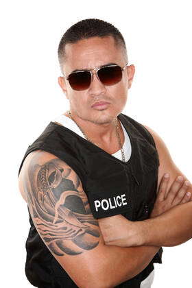 Tough Hispanic Cop in Bulletproof Vest and Sunglasses