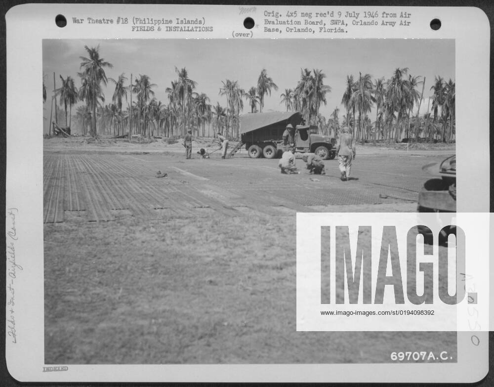 American GI s add the finishing touches to the landing strip under ...