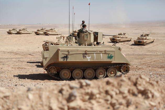 Several tanks of the Jordanian Armed Forces are positioned ahead of a ...