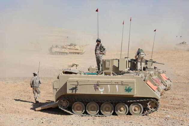 Several tanks of the Jordanian Armed Forces are positioned ahead of a ...