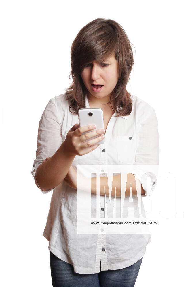 Woman staring at smartphone in shock open-mouthed young woman staring ...