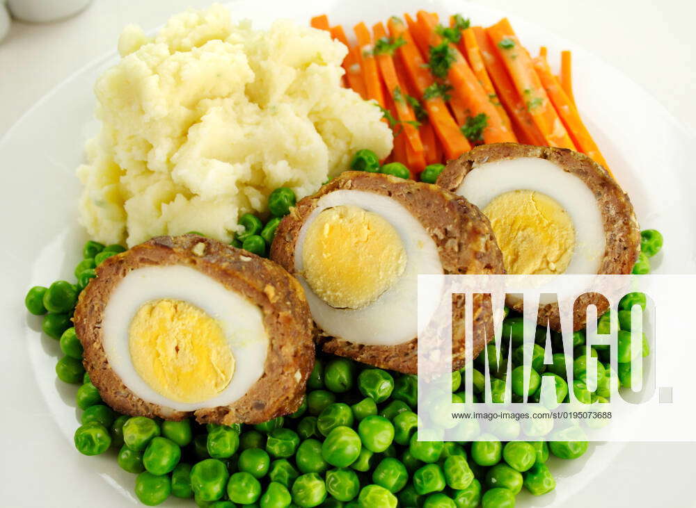 Delicious scotch eggs with peas, carrots and mashed potato. , 8282728